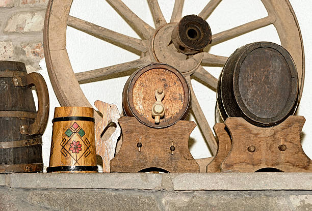 istock wagon wheel and antique wooden small draught beer keg 465113975
