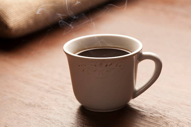 istock white cup of coffee with beautiful smoke 465114806