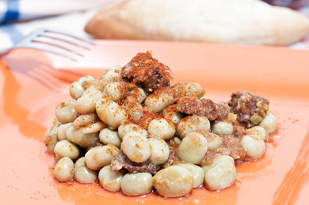 broad bean Plate of beans with sausage fabes stock pictures, royalty-free photos & images