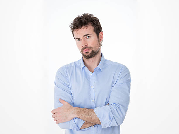 istock young man in formal clothes with questioning gaze 465115624