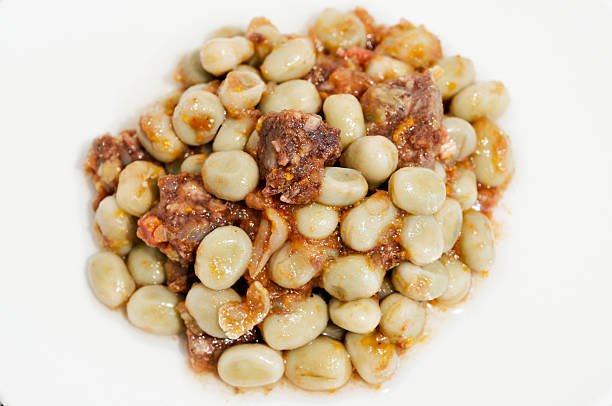 broad bean Plate of beans with sausagePlate of beans with sausage fabes stock pictures, royalty-free photos & images