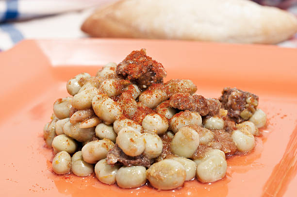 broad bean Plate of beans with sausagePlate of beans with sausage fabes stock pictures, royalty-free photos & images
