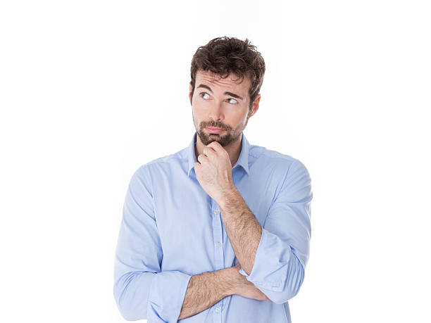 istock young man with hand on chin thinking 465116552