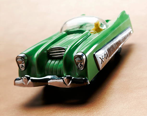 istock Man Driving Green Futuristic Car 465116662
