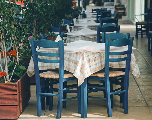 istock Blue chairs on a greek cafe 465117094