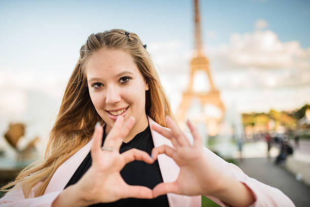 istock woman doing an heart shape 465119040