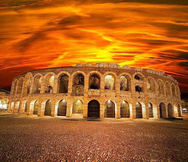 Arena of Verona at Sunset - Italy Arena of Verona at sunset (I-III century), roman amphitheater, symbol of the city of Verona (UNESCO world heritage site), Veneto, Italy verona opera stock pictures, royalty-free photos & images