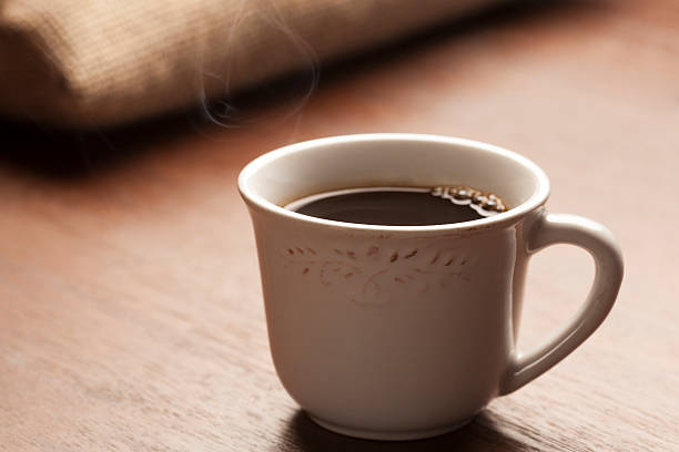 istock white cup of coffee with beautiful smoke 465121544