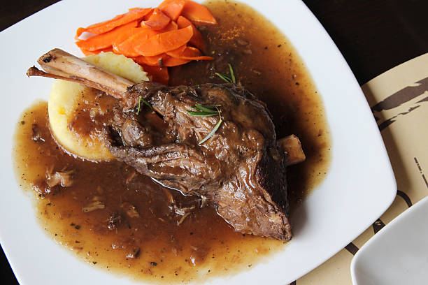 istock Braised lamb shank in mint and rosemary gravy 465121730