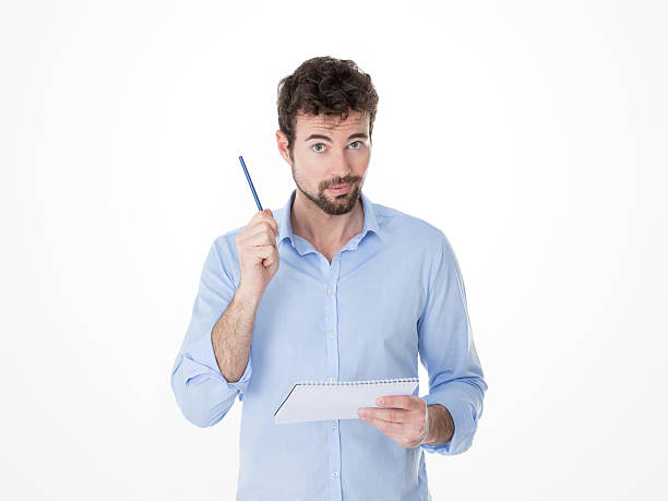 istock one man lifts up his pen to make a question 465123922