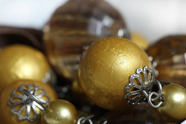 istock macro gold bead ,golden ball and pearl 465124330