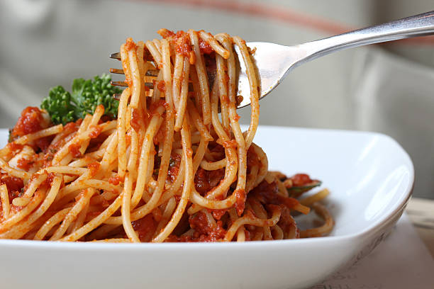 istock Fresh spaghetti with tomato sauce close up 465124660