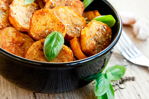 istock Roasted spicy potato wedges in a bowl 465124681