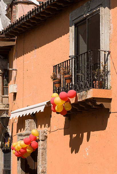 istock Balcony on old Building festooned with balloons Cuernavaca Mexico 465125087