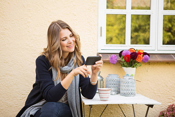 istock Woman outdoors in front of her house. 465126024