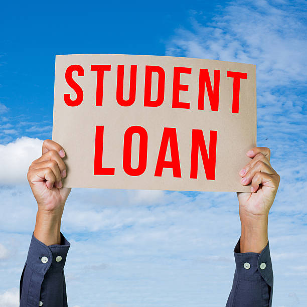 istock Man hand holding paper with student loan word 465126283