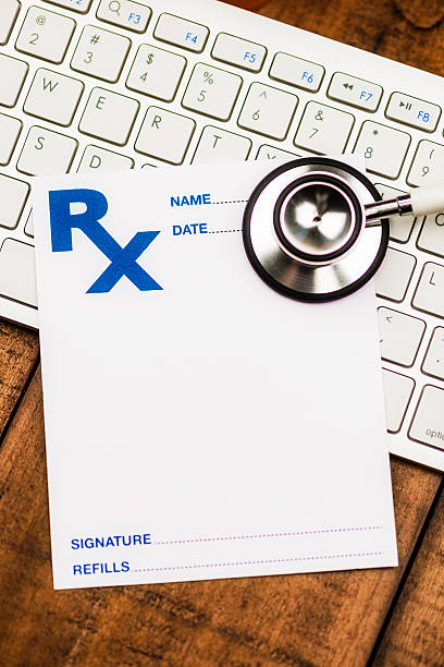 istock Doctor's Orders. Blank prescription form on keyboard with stethoscope. 465126698