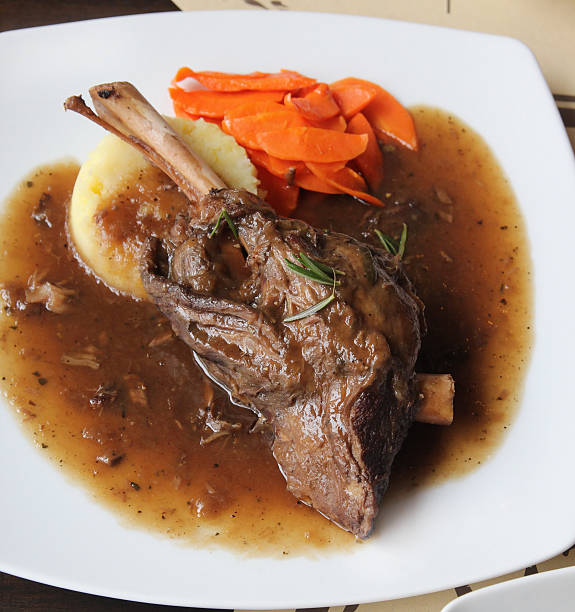 istock Braised lamb shank in mint and rosemary gravy 465128028