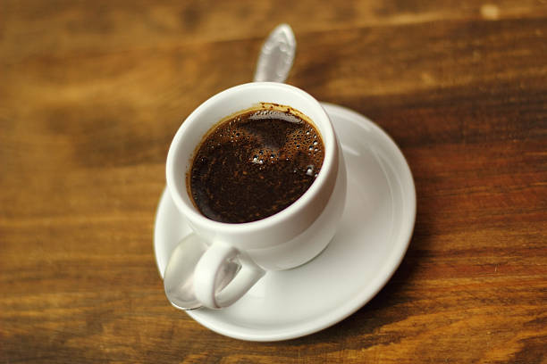istock Coffee Cup on a wooden plank table 465129551