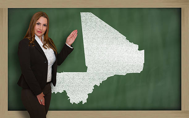 istock Teacher showing map of mali on blackboard 465131566