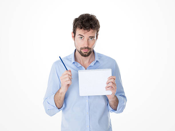 istock guy holding a pen up in his hand 465131632
