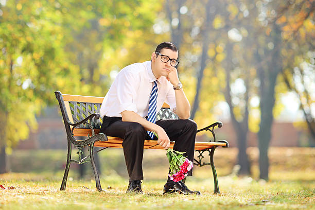 Young man waiting for girlfriend in shopping mall. Upset man. Bearded man. Woman on shopping. Shopping concept.