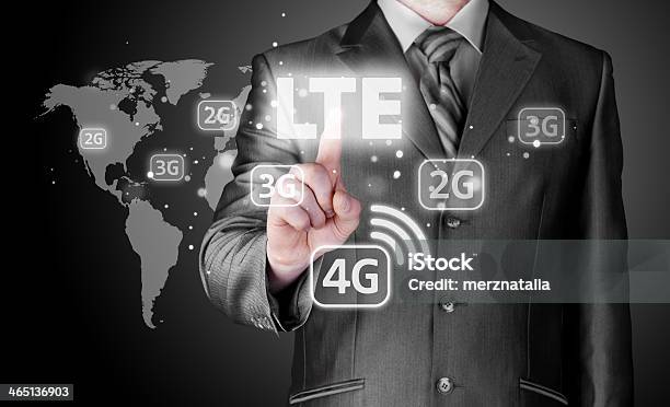 Businessman Is Pushing His Finger On Lte Button Stock Photo - Download Image Now - Adult, Broadcasting, Business