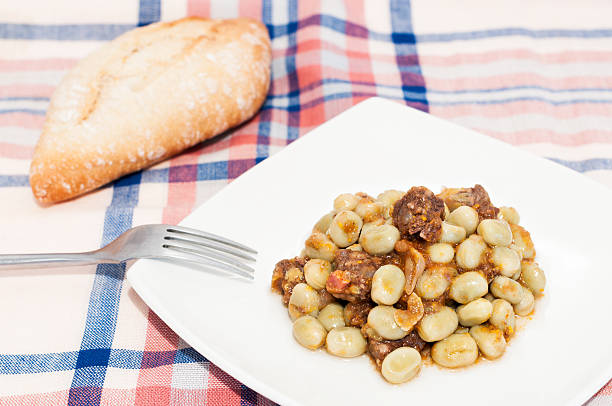 broad bean Plate of beans with sausagePlate of beans with sausage fabes stock pictures, royalty-free photos & images