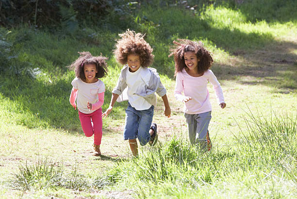 istock Three Children Playing In Woods Together 465138885
