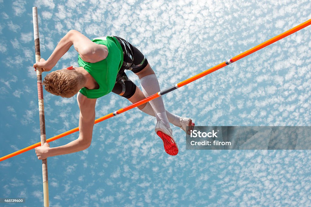 Pole vault sky Young athletes pole vault seems to reach the sky Track And Field Stock Photo