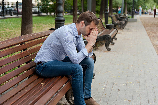 istock Man sits in the public garden 465140671