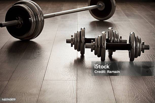 Dumbells For Fitness On Wooden Floor Stock Photo - Download Image Now - Active Lifestyle, Animal Muscle, Antique