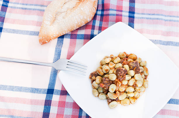 broad bean Plate of beans with sausagePlate of beans with sausage fabes stock pictures, royalty-free photos & images