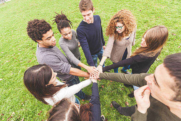 istock Multiracial group of friends with hands in stack 465141672