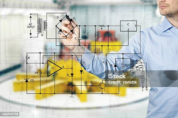 Electrical Engineer Draws A Diagram Of A Circuit Stock Photo - Download Image Now - Electricity, Plan - Document, Drawing - Activity