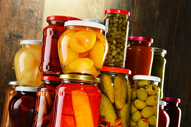 istock Jars with pickled vegetables, fruity compotes and jams isolated 465145306