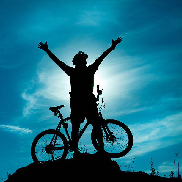 happy biker with outstreched hands to the sky