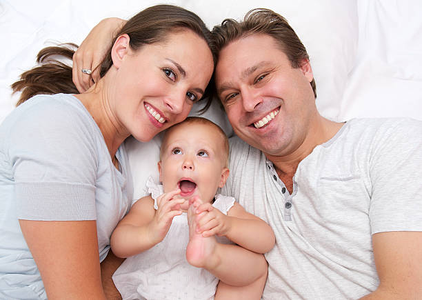 istock Young family smiling with cute baby 465146611