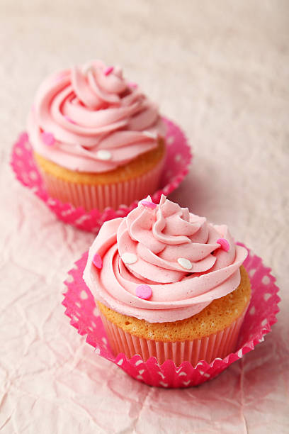 istock Tasty cupcakes on pink background 465147606