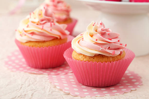istock Tasty cupcake on pink background 465147608