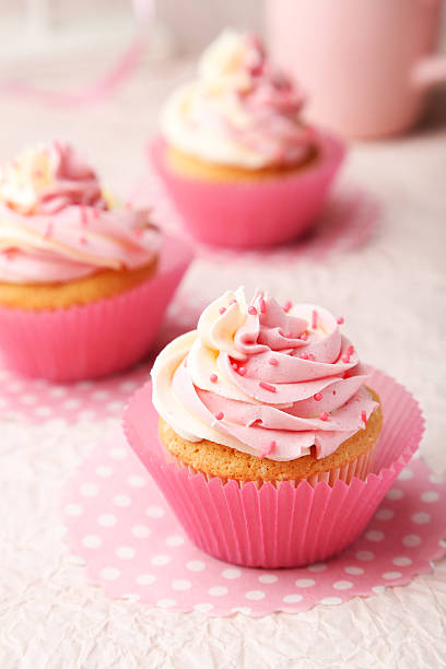 istock Tasty cupcake on pink background 465147622