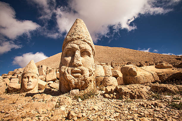Photograph of large statues in Nemrut Ruins on Nemrut Mountain. natural landmark stock pictures, royalty-free photos & images