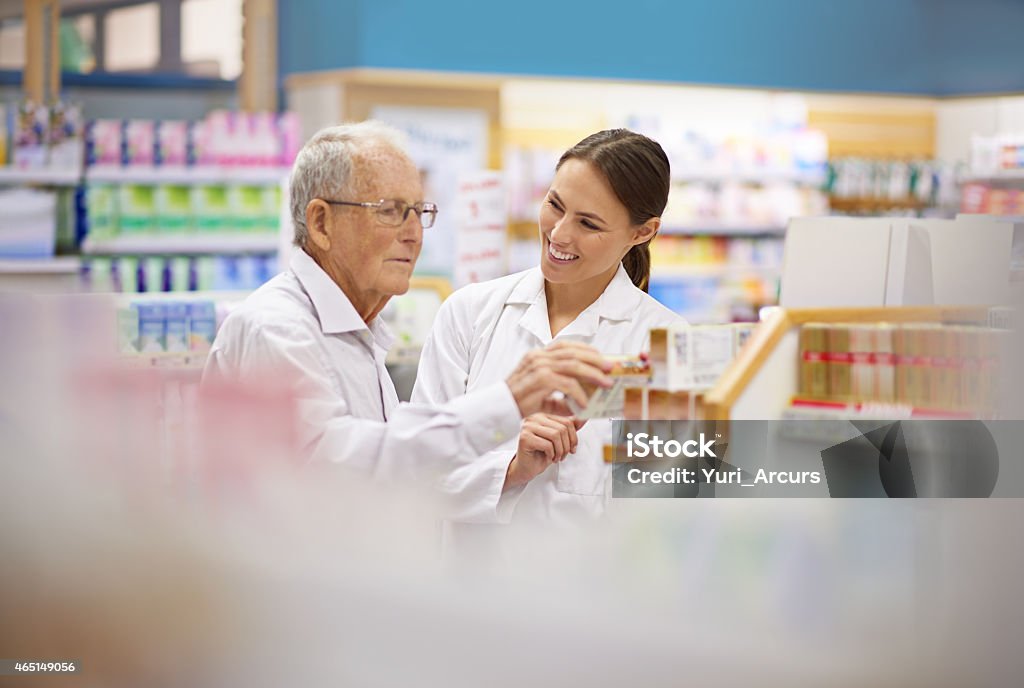 Making sure her customer's are taken care of Shot of a young pharmacist helping an elderly customer. The commercial product(s) or designs displayed in this image represent simulations of a real product, and are changed or altered enough so that they are free of any copyright infringements. Our team of retouching and design specialists custom designed these elements for each photo shoot http://195.154.178.81/DATA/i_collage/pi/shoots/785200.jpg Pharmacy Stock Photo
