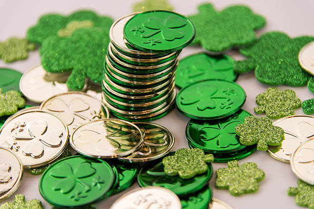 istock Saint Patrick's Day - coins and shamrocks 465149816