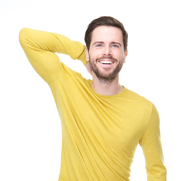 istock Happy young man smiling with hand in hair 465152889