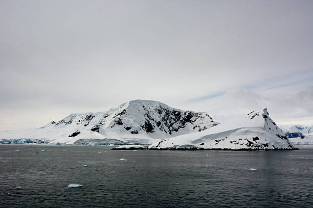 istock Snow-capped black mountain in Antarctica 465153182