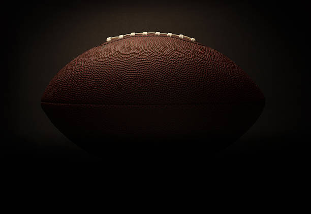 Football on a black background stock photo
