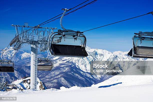 Chairs On Chairlift Ropeway In Winter Mountains Stock Photo - Download Image Now - 2015, Activity, Alpine Skiing