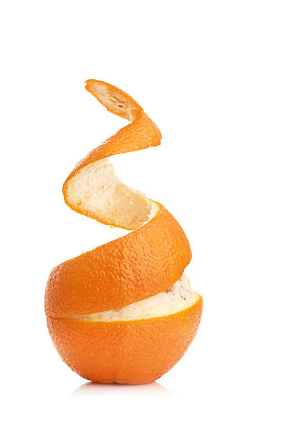 istock orange with peeled spiral skin 465154525