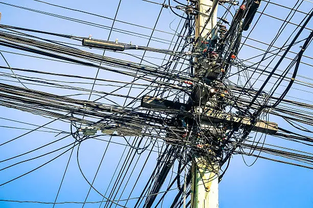Photo of Messy electrical cables in thailand - Uncovered optical fiber technology